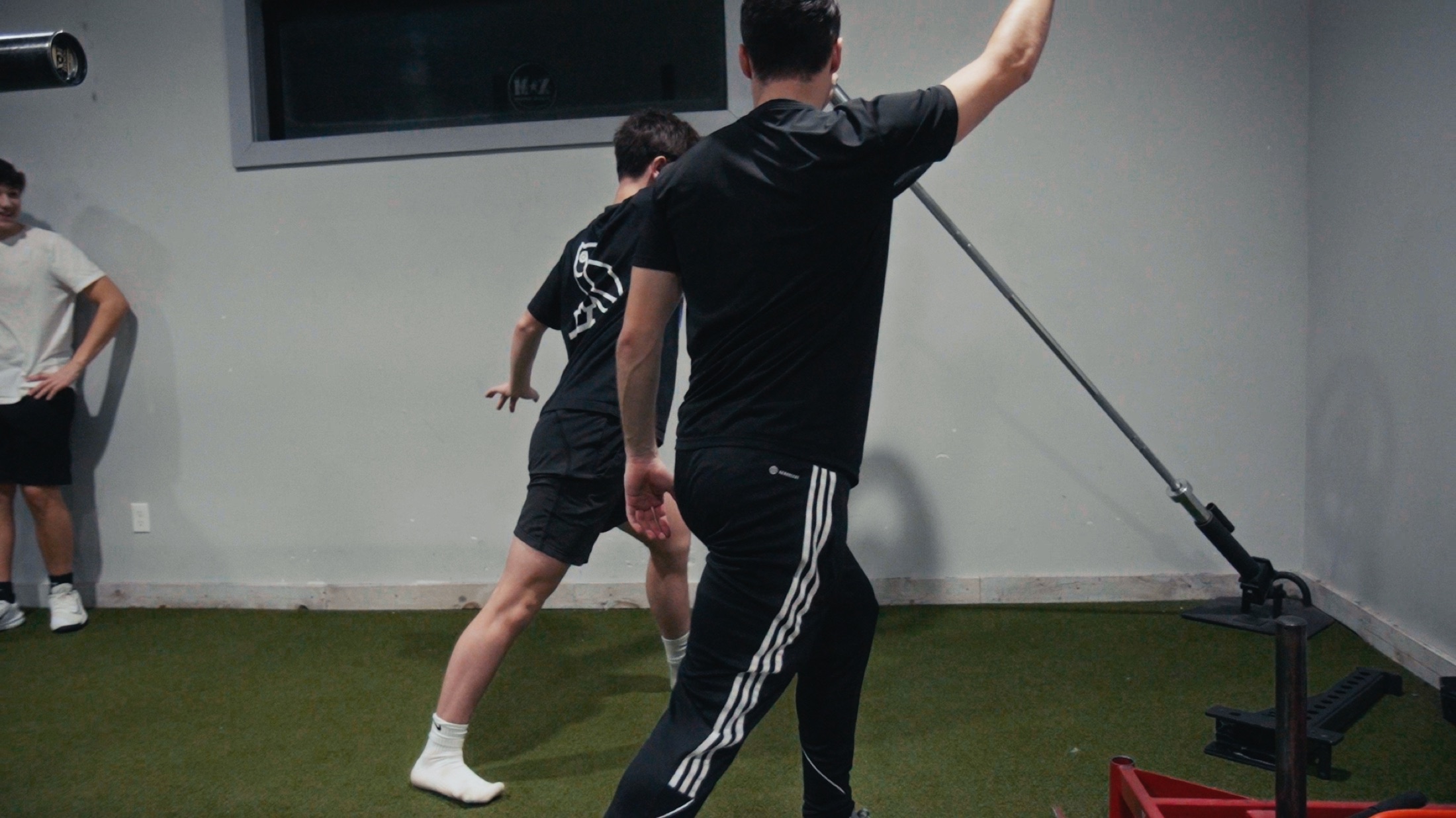 A Generations coach leading an athlete through resisted movement training